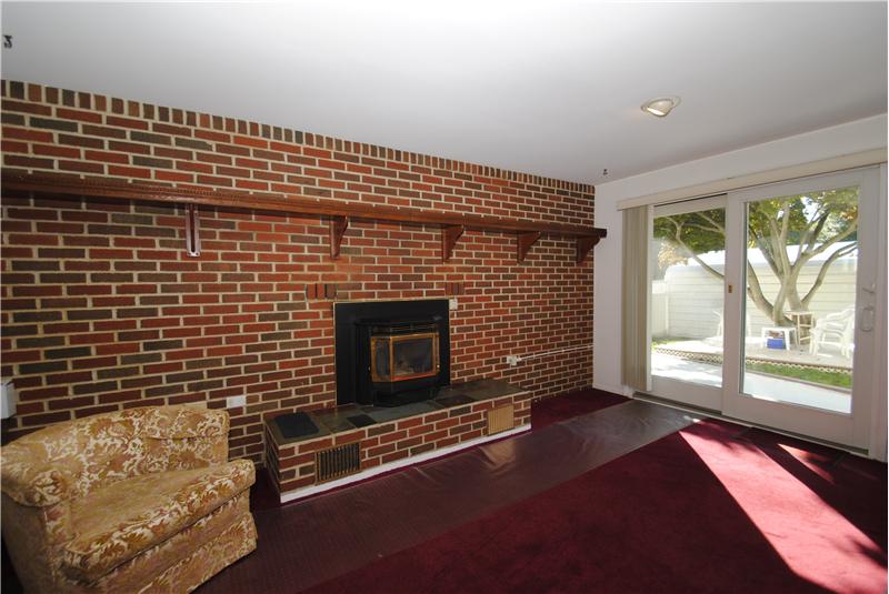Lower Level Family Room with Gathering Fireplace