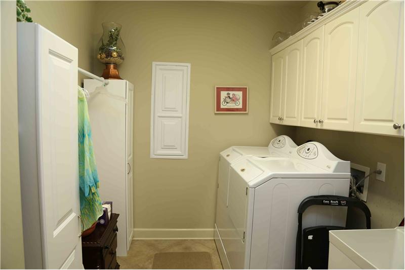 Utility room with cabinets and more