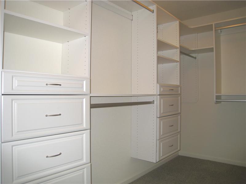 Closet organizers in master closet