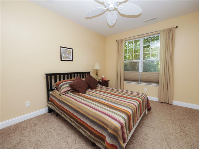 Secondary bedroom overlooking backyard
