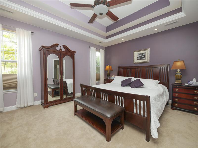 Elegant master bedroom with double tray ceiling