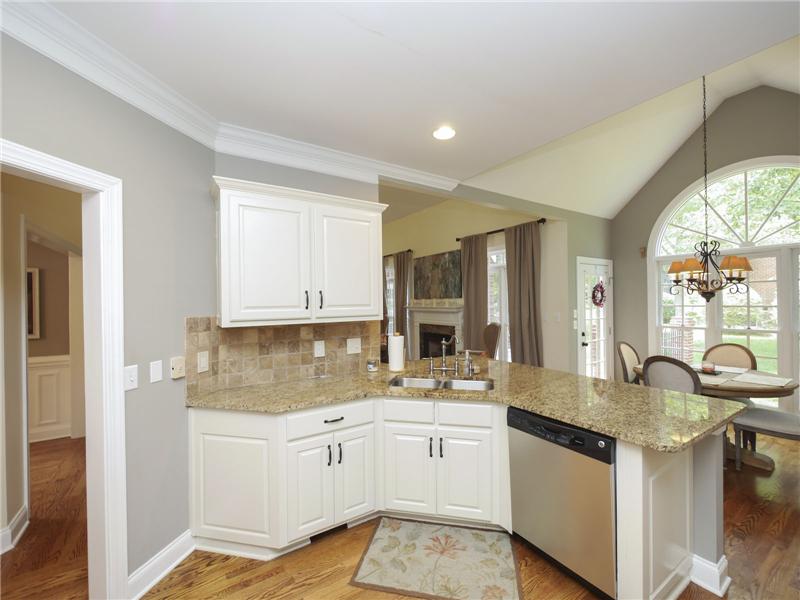 Granite countertops and tile backsplash
