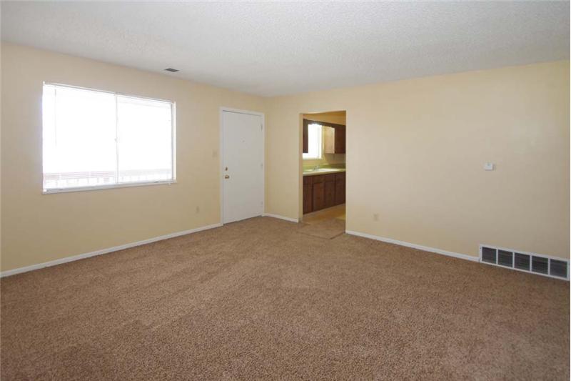 Unit #3 - Living Room with new carpet and paint