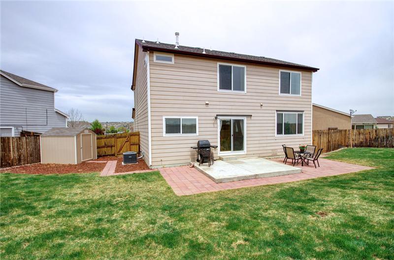 View of the large backyard and patio!
