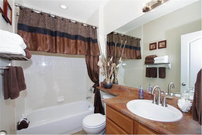 Main level full bath with kitchen height vanity
