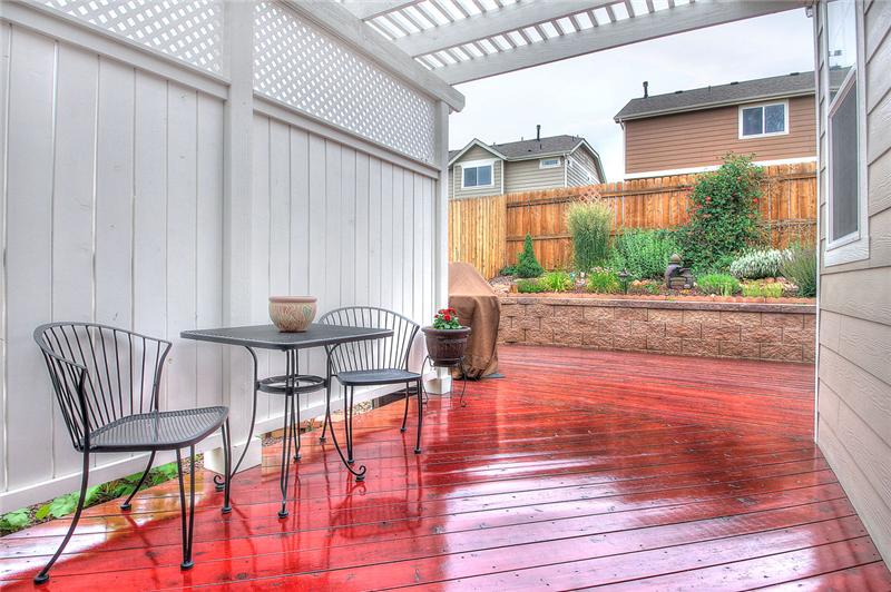 View of the deck with pergola and beautifully landscaped, private backyard!