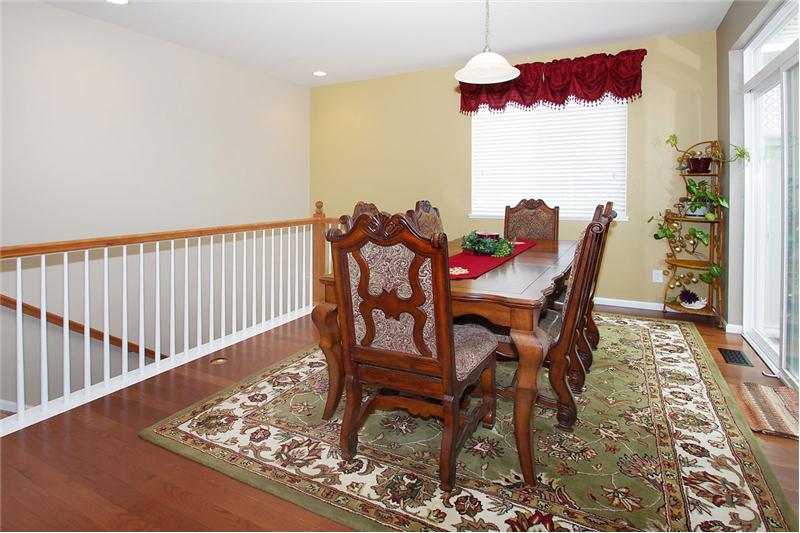 Dining room walks out to wood deck with Pergola