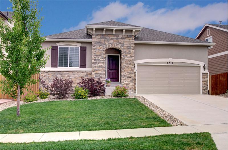 Attractive stone and stucco exterior with a covered entryway
