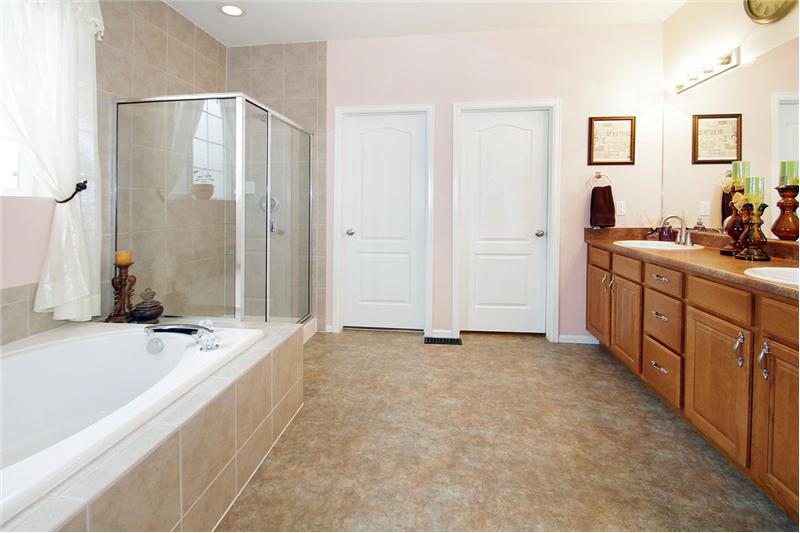 5-piece bath with double sinks, a garden tub, and kitchen height vanity