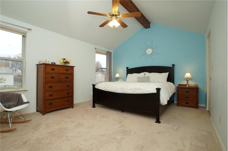 Master bedroom with vaulted ceiling