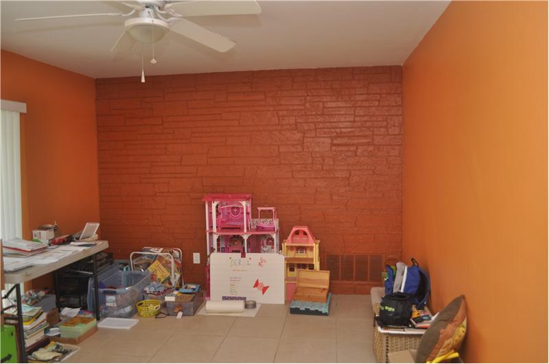 Family room with sliding doors to the fenced in yard.