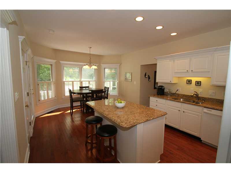 Updated kitchen w/granite counter tops, hardwood floors & appliances.