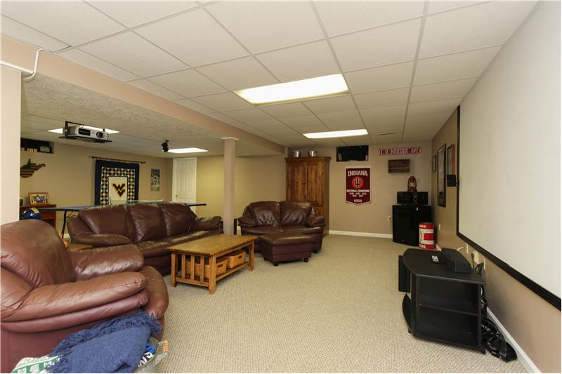 Finished basement w/theater equipment included.
