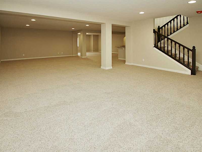 Finished daylight basement includes wet bar, bedroom, full bath & plenty of storage.