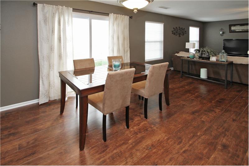 Dining room is open to great room & kitchen.