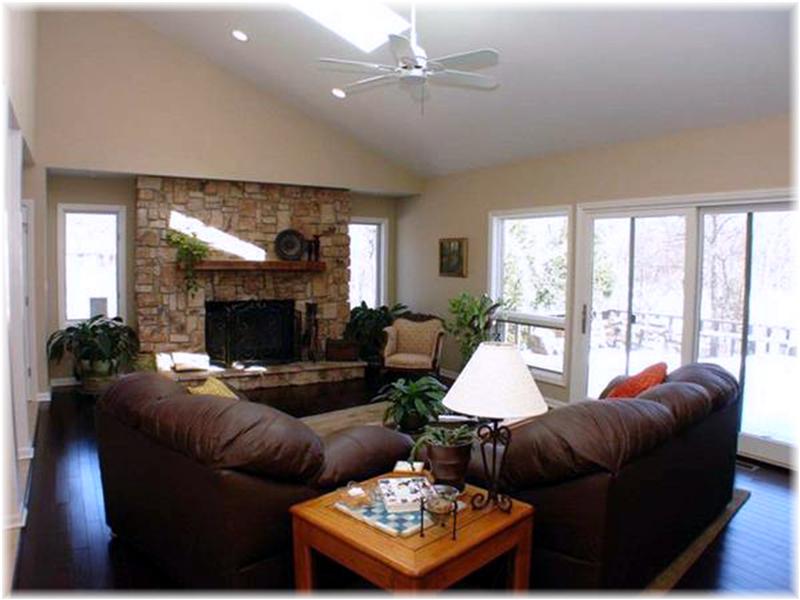 Family Room with Fireplace overlooks Private Yard