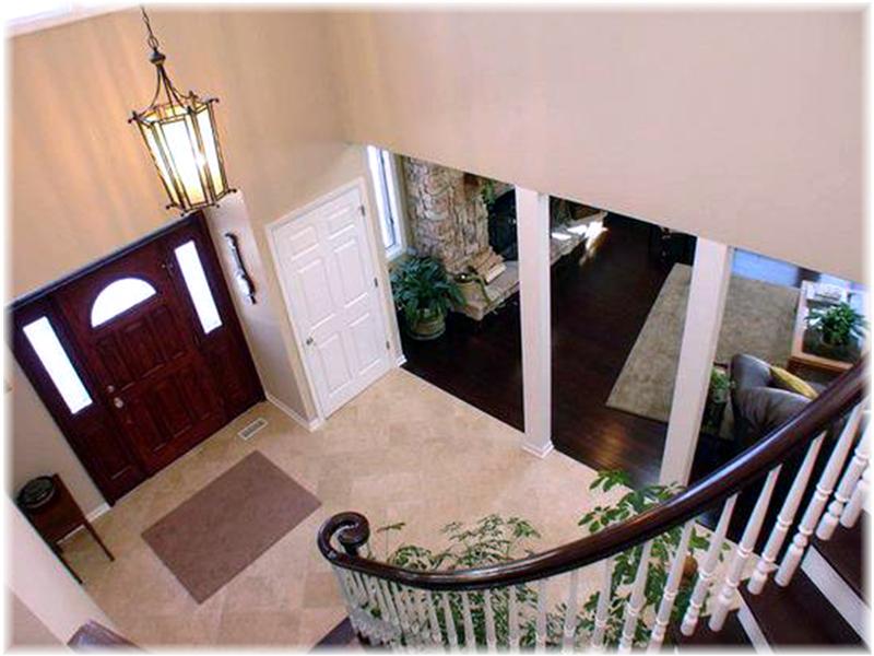 Elegant Formal and Custom Staircase Greets Your Guests