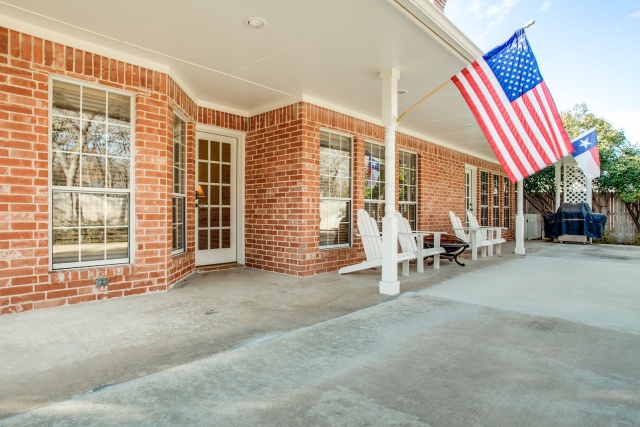 Enjoy your covered porch with an extended patio in back!