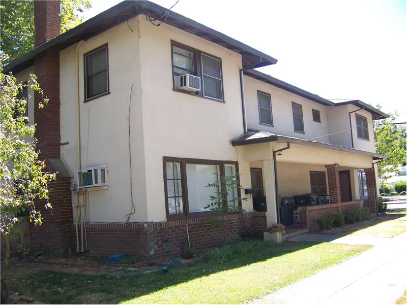 Duplex with stucco and brick trim