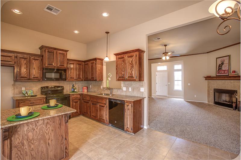 KITCHEN WITH VIEW OF LIVING ROOM