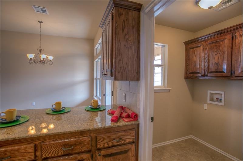 KITCHEN WITH VIEW OF UTILITY ROOM