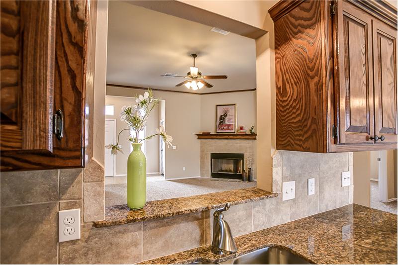 KITCHEN WITH VIEW OF FIREPLACE 