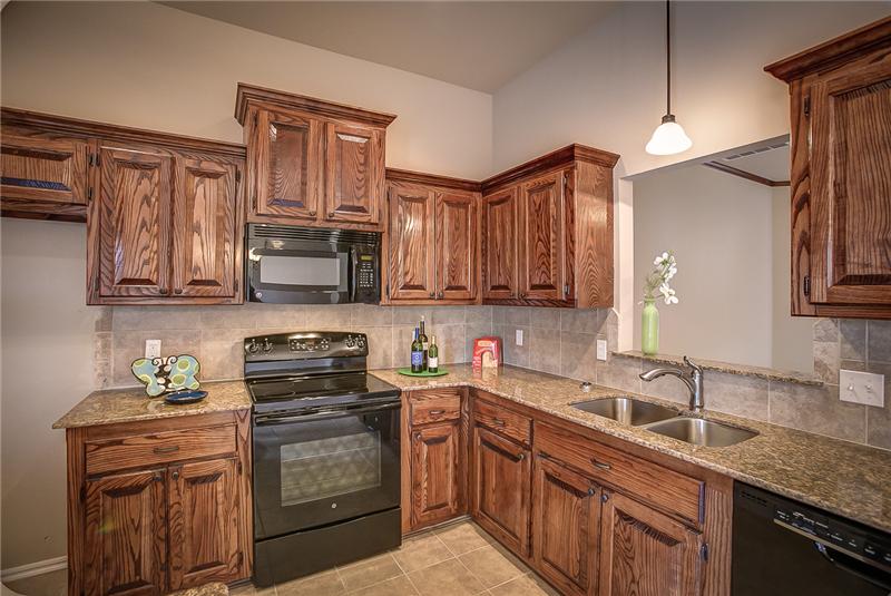 KITCHEN WITH GRANITE COUNTER TOPS 