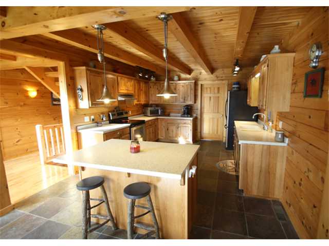 Kitchen:  Kitchen w/ solid surface counters, SS appliances, HUGE pantry