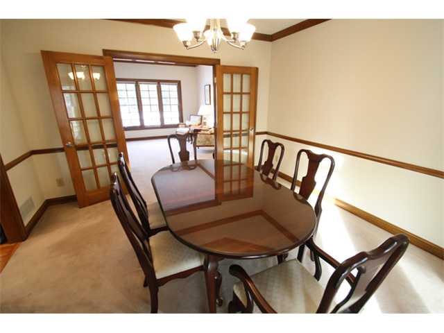 Dining Room:  Holiday size dining room with tray ceiling, crown and chair rail. Updated lighting.