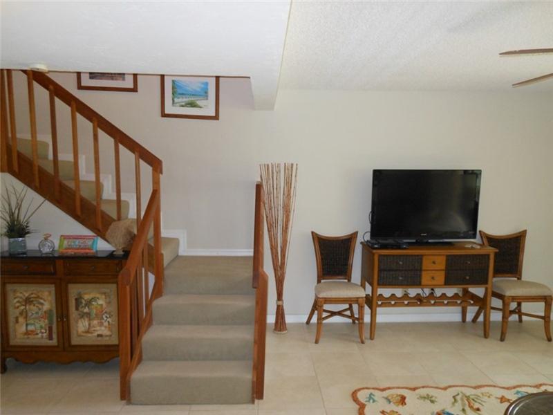 Stairway to bedrooms and two bathrooms