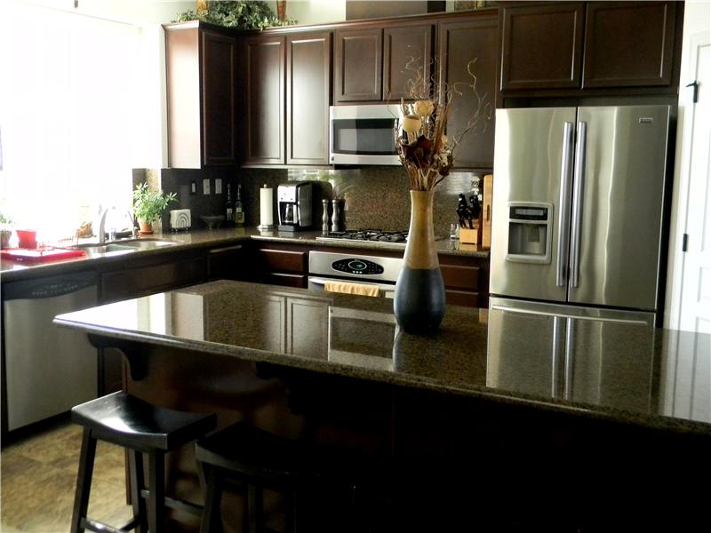 Gorgeous kitchen with granite counters, stainless appliances and beautiful tile floors