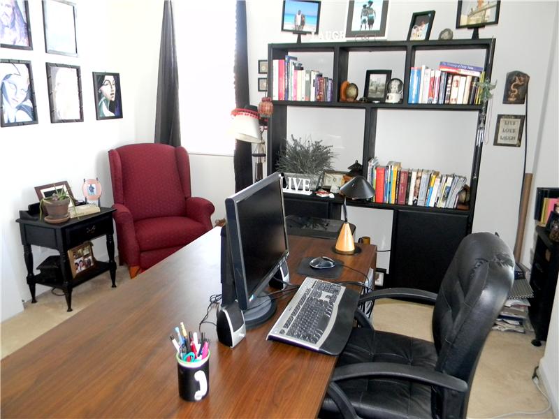 Double doors lead into the office/den which is across from the master bedroom