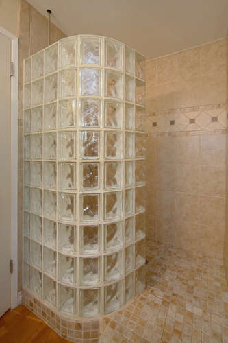 Stone Tiled Shower with Glass Block Wall