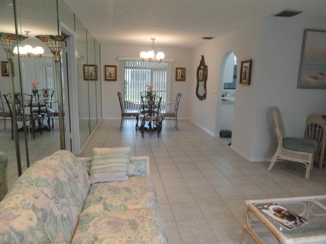 Dining with Sliders Out to Screened Patio