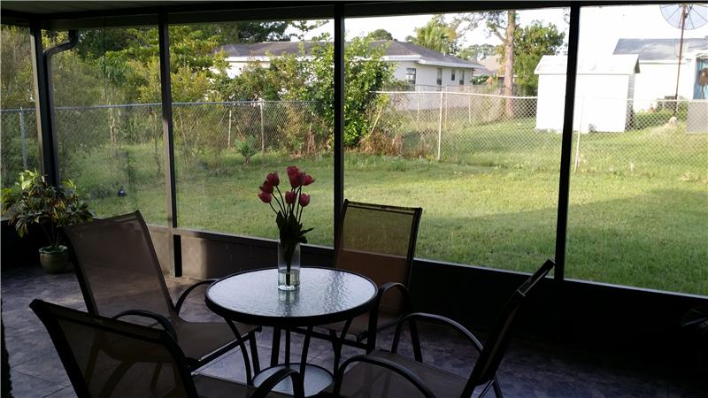 Screened Patio overlooking fenced yard, room for a pool.