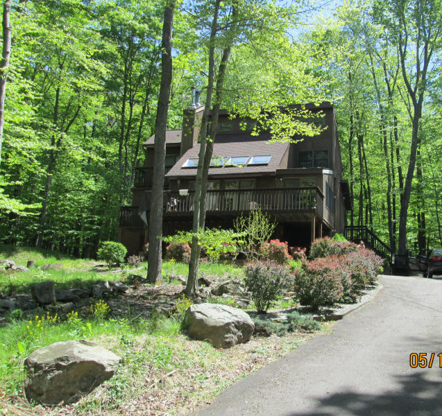 EXTERIOR VIEW FROM STREET- PAVED DRIVEWAY 