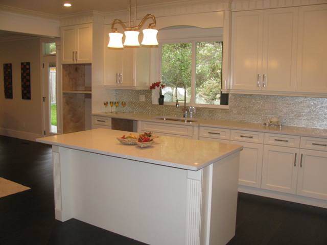 Kitchen with room for wall oven and window overlooking greenbelt