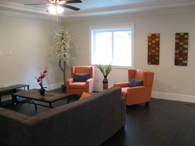 Family room has a ceiling fan