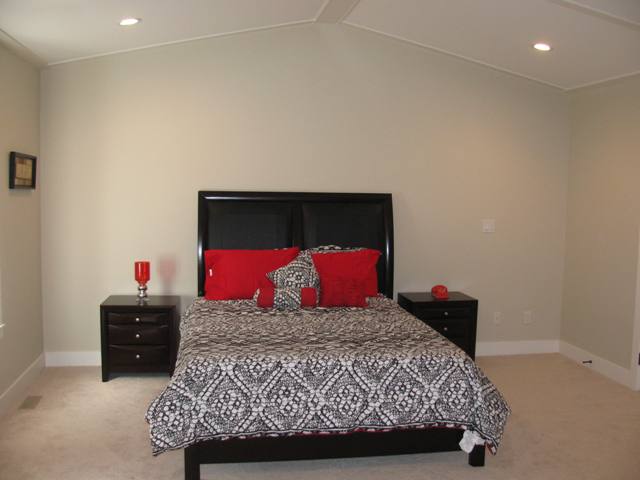 Master bedroom with vaulted and coffered ceiling