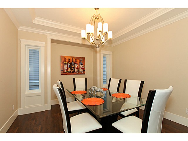 Dining room with alcove and coffered ceiling