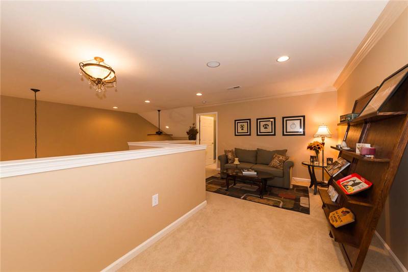 View of loft from 3rd bedroom & main bath.