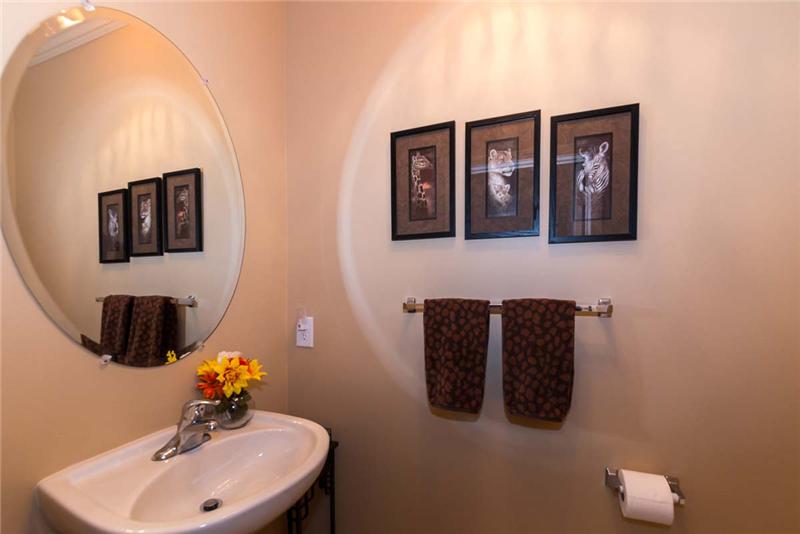 Powder Room adjacent to laundry and garage.