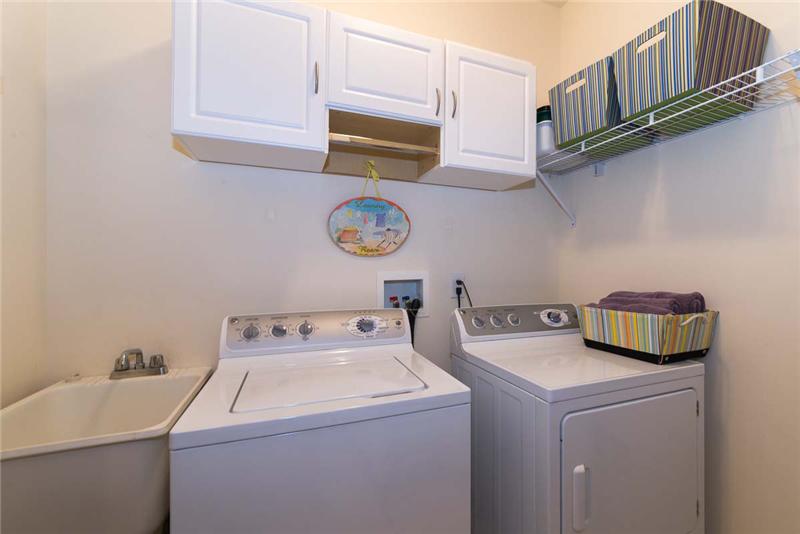 Laundry room with King-sized capacity GE washer and GE dryer