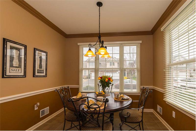 Eat-in-Kitchen Dining Area with Chair Rail. Windows have 2
