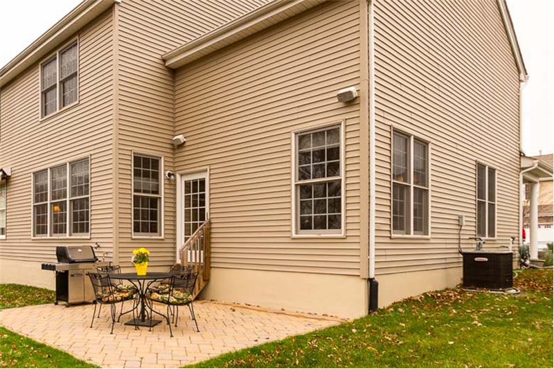 Rear extended patio with pavers in Chestnut color to coordinate with vinyl siding.