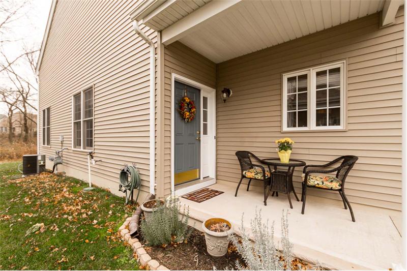 Covered front entry porch is great for greeting guests or a place to read, relax, and snack.