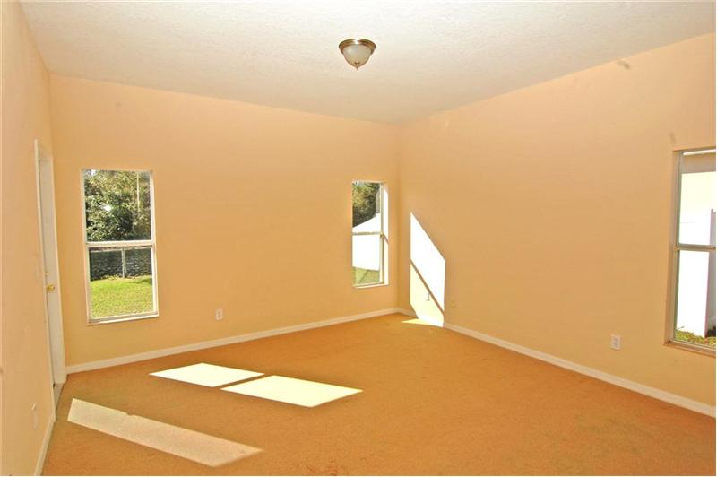 Master Bedroom with Private Door to Lanai & Waterview.