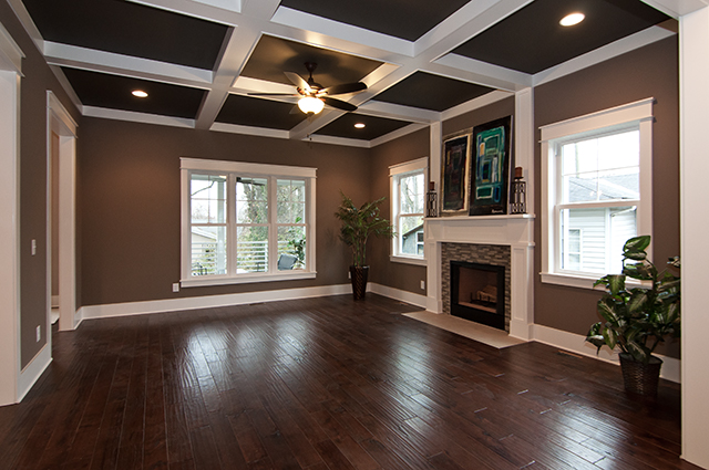 Coffered ceiling in great romm + wood-bruning fireplace