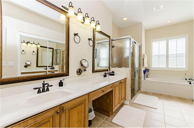 huge master bath with his and her closets