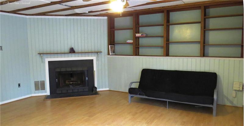 Finished Family Room in Basement with Wood Burning Fireplace
